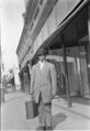 1905-1915-otto-0295-man-on-street-with-suit-case-1600.jpg