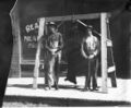 1915-cap-001-two-men-in-front-of-meat-market-with-bear-1600.jpg