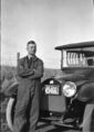 1918-auto-0018-man-by-car-field-1600.jpg