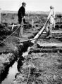 1959-beautification-031a-working-on-sewer-line-in-wet-hole.JPG