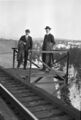 1905-1915-otto-0139-two-men-on-trestle-spokane-river-1600.jpg