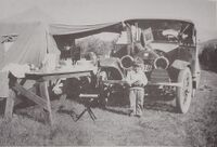 1915 touring car on 1926 Aldrich family cross country camping trip at camp site. They usually stopped at schools because they had a place to park, water, and an outhouse.